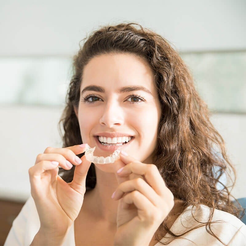 Woman holding retainer